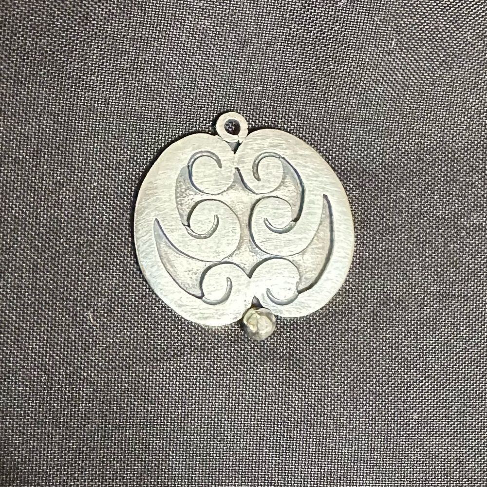 Vintage Silver Oval Pendant with raised swirl designs